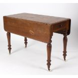 An early mahogany Pembroke table, on baluster turned legs with ceramic castors,