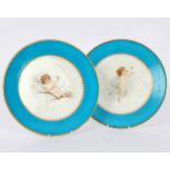 A pair of Minton plates decorated fairies within blue celeste borders, signed beneath Florence Judd,