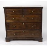 An 18th Century oak chest of two short over three long drawers,