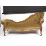A Victorian walnut single chair back settee with deep button back and carved scroll arms,
