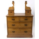 A late Victorian dressing table with mirror back above two short and two long drawers,