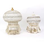 Two lantern style wirework birdcages painted white,