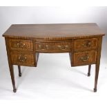 A George III style mahogany bowfront dressing table, fitted a small brushing slide and five drawers,