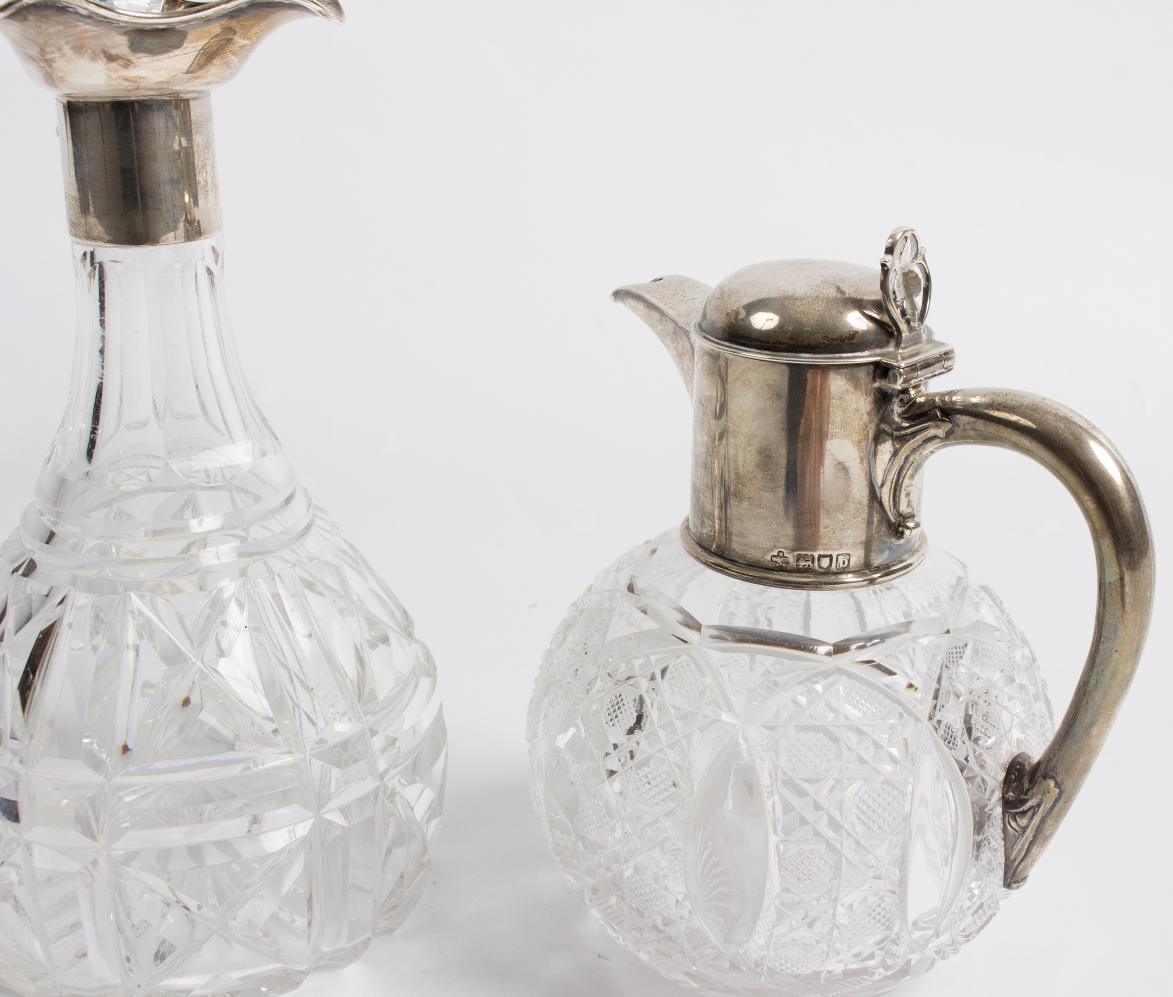 A spherical cut glass claret jug, the silver mounts, HW & Co.