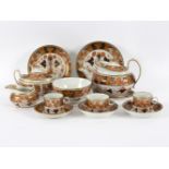 A New Hall tea set, circa 1810, pattern 893, decorated in the Imari palette, comprising teapot,