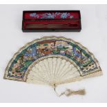 A 19th Century Cantonese fan, with carved guards and sticks,