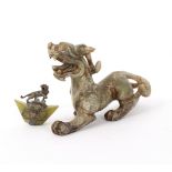 A Chinese nephrite carving of a prowling temple dog,