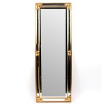 A modern mirror with a mirrored glass frame,