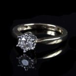 A diamond solitaire ring, the six claw set diamond measuring approximately 0.