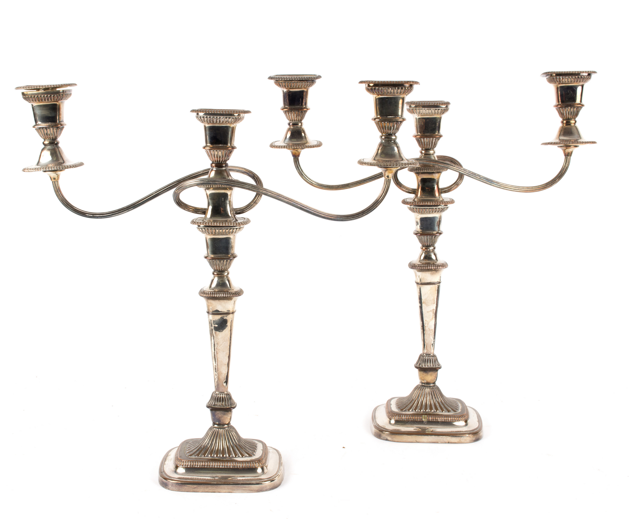 A pair of Sheffield plate candlesticks with gadroon borders,