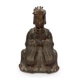 A Chinese late Ming bronze figure of the Daoist deity Wenchang Wang, showing signs of worn gilding,