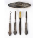 A small group of silver including nail buffer, nail file,