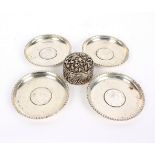 Four Indian silver ashtrays, each set with a one Rupee coin (1835, 1840,