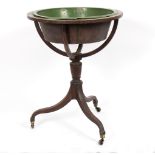 A Regency mahogany globe stand, on a turned column tripod support with castors,