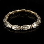 A diamond bracelet of eleven oblong cluster links,