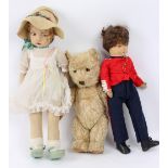 Two cloth dolls and a teddy bear