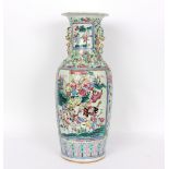 A Cantonese vase with reserves of figures within buildings,