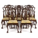 A set of eight 18th Century style dining chairs with pierced carved splat backs,