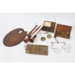 A set of oak cased guinea scales, a mahogany cased set, an artist's palette, a fisherman's priest,