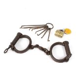 A pair of 19th Century handcuffs,