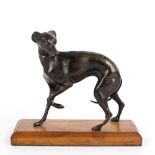 A bronzed metal whippet, after P J Mene, mounted on a wood plinth, 15.