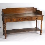 A Victorian mahogany washstand, the three-quarter galleried top above three drawers,