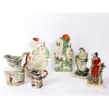 Two 19th Century Staffordshire figures, Elijah and Widow, two Staffordshire flatback groups,