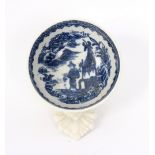 A Caughley blue and white circular wine taster printed with the Fisherman pattern,