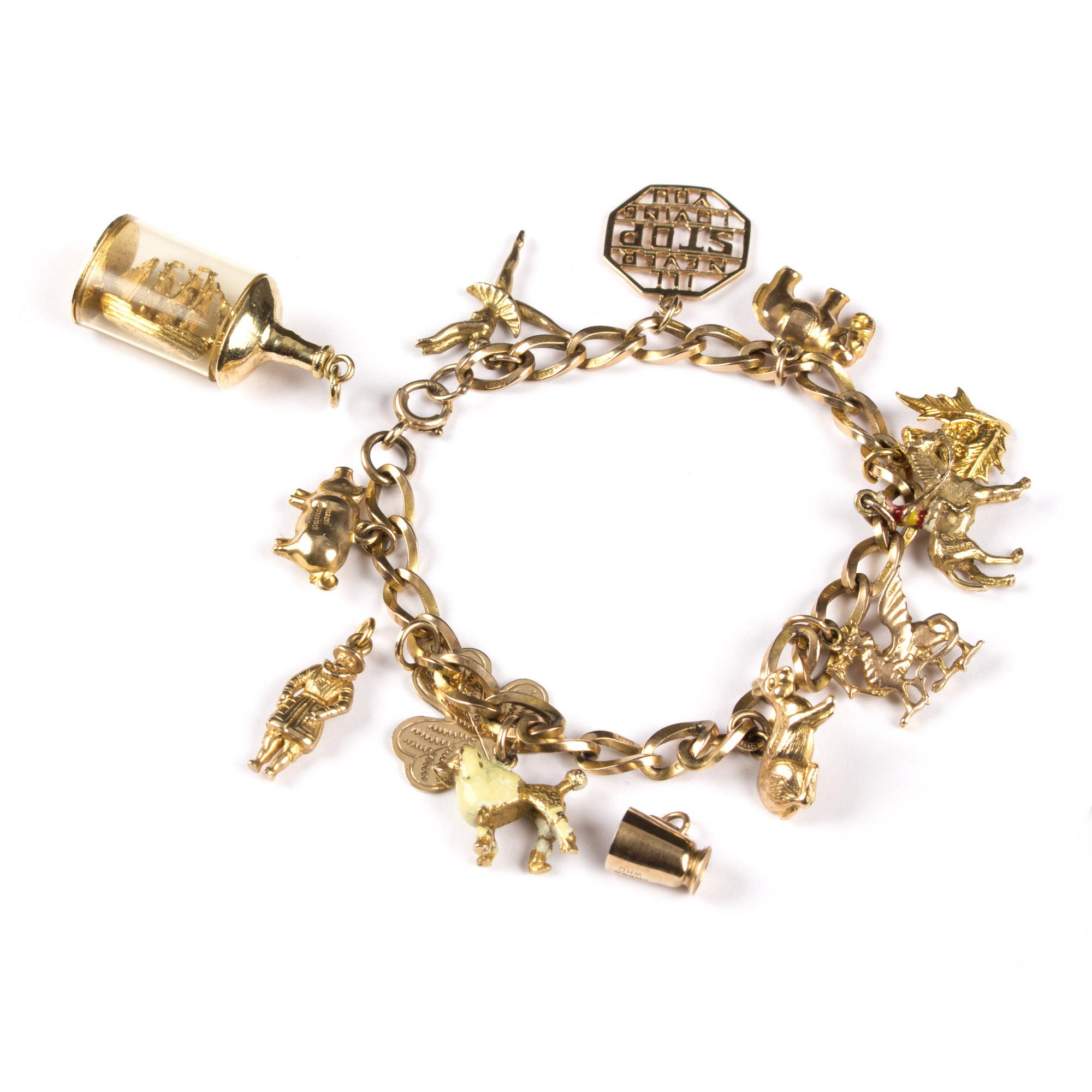 A gold charm bracelet, charms to include a ship in a bottle, a ballerina, Welsh dragon etc. - Bild 2 aus 2