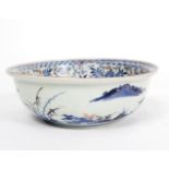 A Japanese Imari bowl, circa 1850, with flared rim painted with pavilions within landscape, 21.