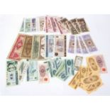 An accumulation of World coins and banknotes including USA $1, Bank of England £1 notes, Chinese,