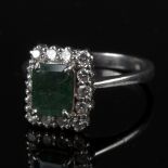 An emerald and diamond ring,