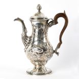An Irish silver pear-shaped coffee pot, Dublin 1775, with raised decoration of fruiting branches,