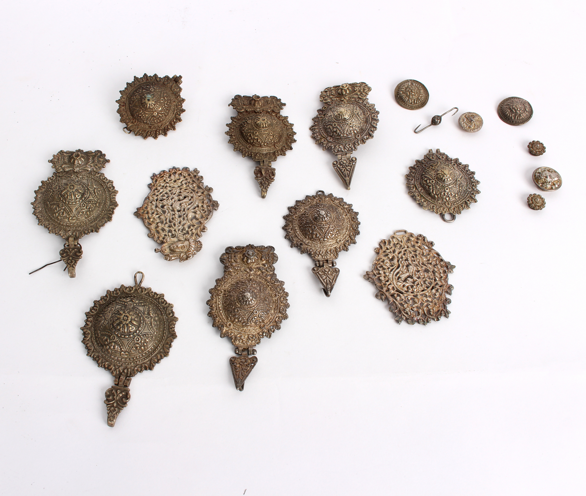 A quantity of Eastern white metal, mainly Burmese, including buckle, buttons etc.