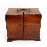 An apothecary's mahogany cabinet with fitted interior,