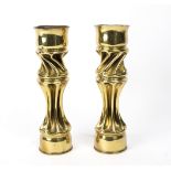 A pair of trench art candlesticks with spiral columns, made from 3.5" mortar shells, 30.