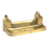 An Art Deco style brass inkstand fitted two inkwells under hinged covers,