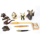 An interesting collection of sundries to include two bone Wesleys, the larger 14cm high,