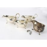 Three silver sauce boats and another (damaged),