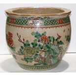 Chinese enameled crackle glazed fish bowl, featuring peonies below a diaper band, 14"w