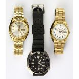 (Lot of 3) Seiko metal wrist watches Including one Seiko 5, manual, 21 jewels, day date, center