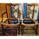 Pair of Chippendale style chairs, including an armchair and side chair, having a serpentine crest