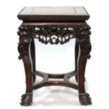 Chinese export wood stand, inset with a square panel within a bead edge, the apron pierced with an
