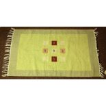 Navajo style flatweave rug, having a light green field, 1'11'w x 35"l