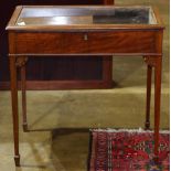 Edwardian table vitrine, having an inset glass paneled hinged top, opening to the display bay, and
