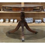 Regency style mahogany drum table with leather-covered rotating top fitted with two drawers and an