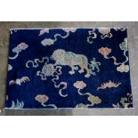 Chinese Peking Rug Fragment c.1935, depicting a fu-lion and bats 4'7" x 3'1".