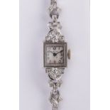 Lady's Glycine, diamond, platinum wristwatch Dial: square, silvered, black Arabic numeral, hour