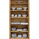 (lot of 55) Six shelves of Abigials ceramic partial table service for 12, executed in the "Fleur