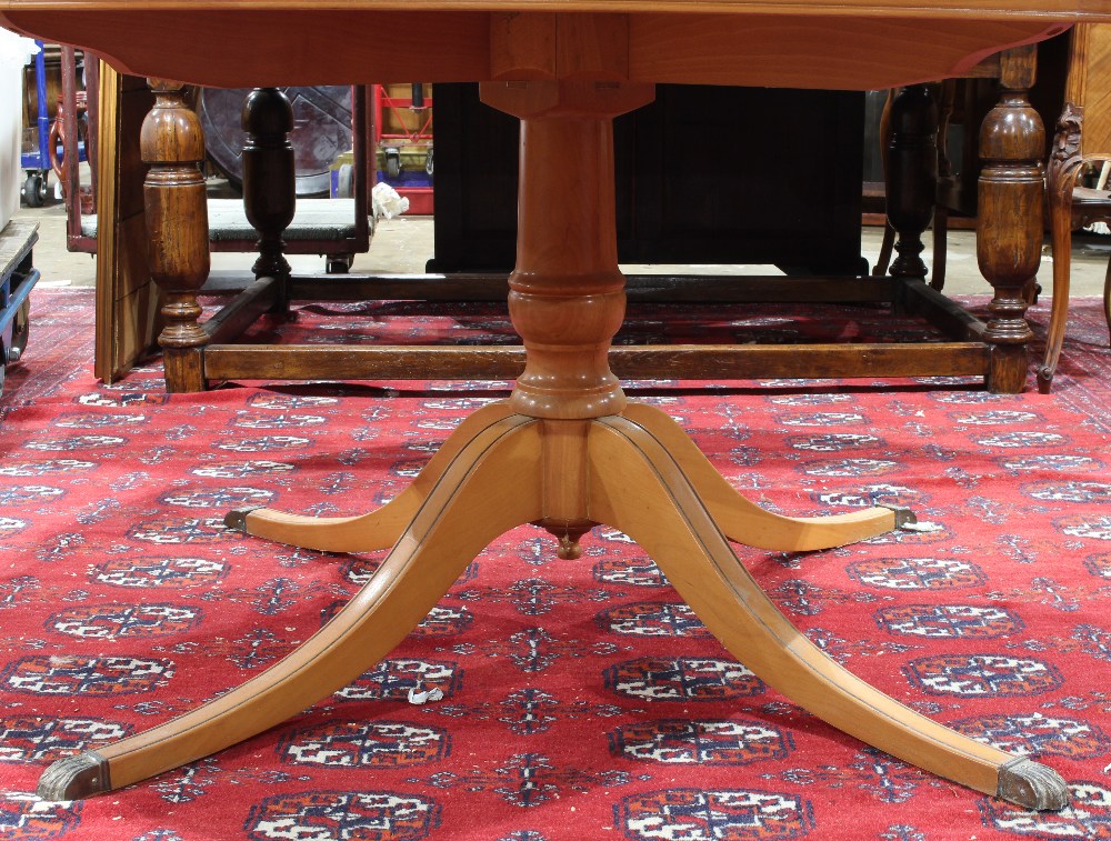 Regency style dining table, the circular top having ebonized banding, and rising on a pedestal - Image 3 of 3